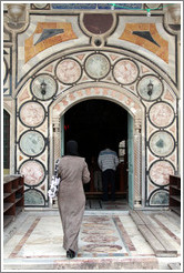 Woman entering Al-Jazzar Mosque.  Old town Akko.