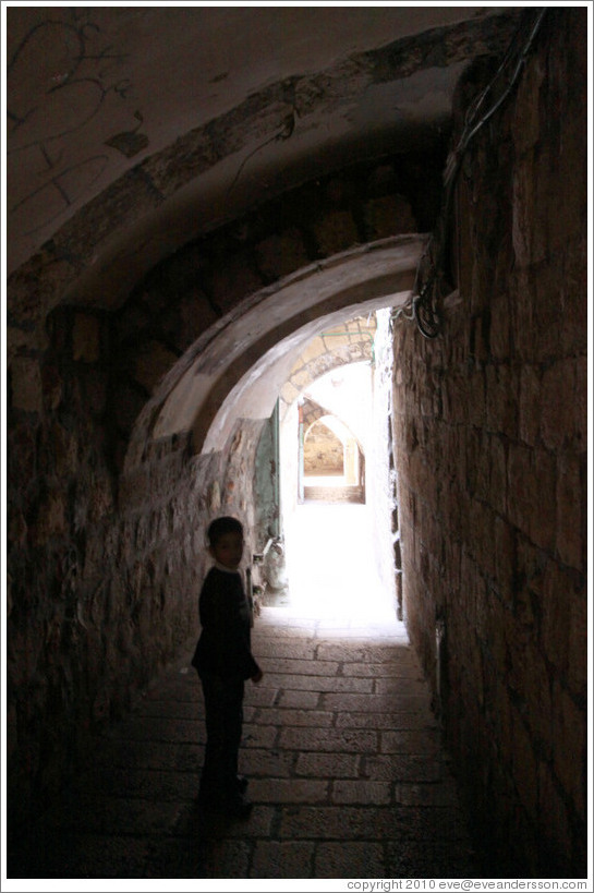 Boy beneath arches, Christian Quarter, Old City of Jerusalem.