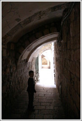 Boy beneath arches, Christian Quarter, Old City of Jerusalem.