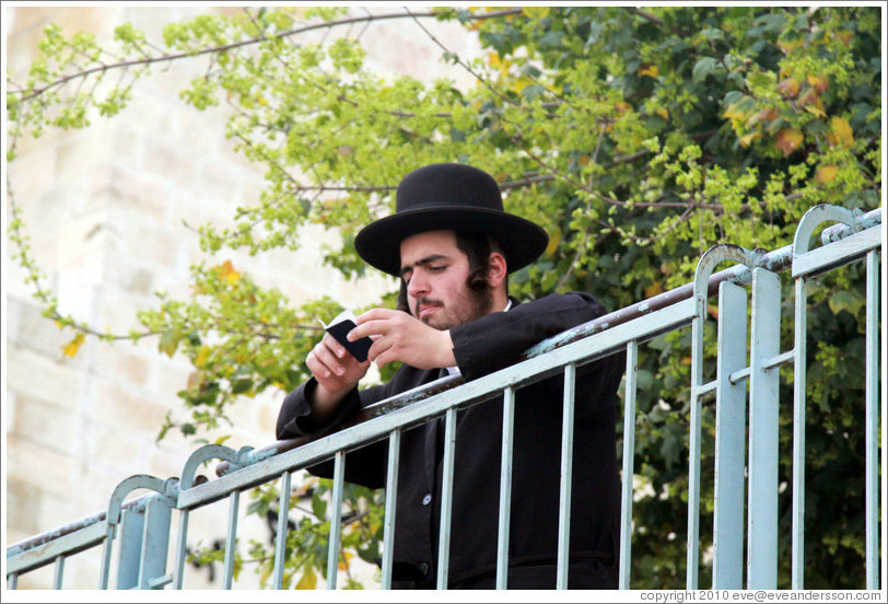 Orthodox Jewish man, on landing above Western (Wailing) Wall, Old City of Jerusalem.