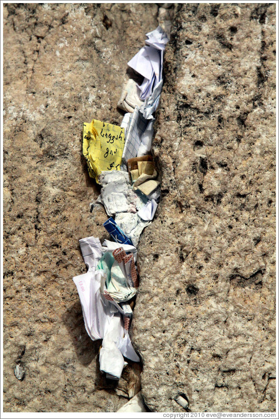 Papers stuffed into a crack in the Western (Wailing) Wall, Old City of Jerusalem.