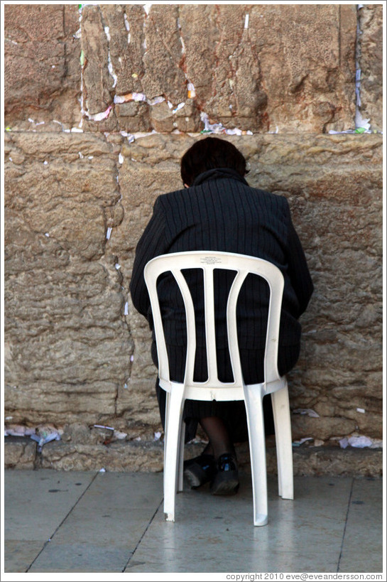 Woman praying at the Western (Wailing) Wall, Old City of Jerusalem.