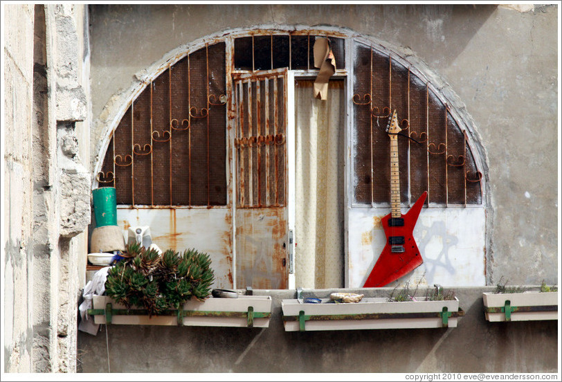 Balcony with an electric guitar, seen from the roof of the Tomb of David, Mt. Zion.