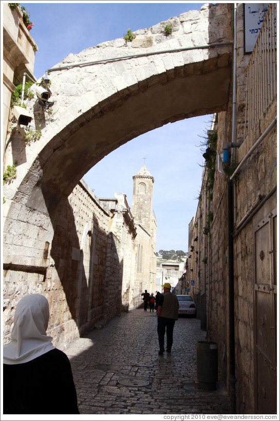 Woman and arch, Via Dolorosa, Muslim Quarter, Old City of Jerusalem.