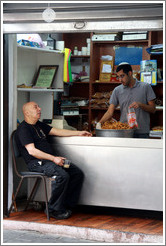 Men in a storefront, Shabazi Street, Neve Tzedek.