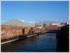 Brick buildings with inlet.