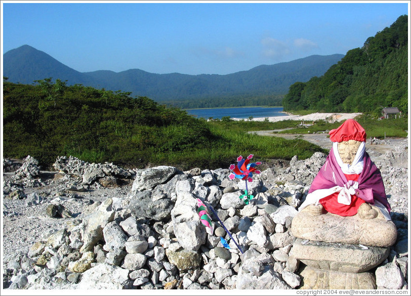 Buddha and pinwheels for deceased children.  Mt. Osorezan.