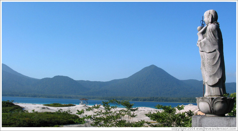Buddha holding baby overlooking crater lake.  Mt. Osorezan.