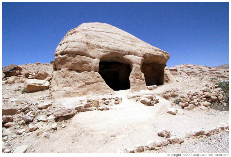 Large stone with two holes.