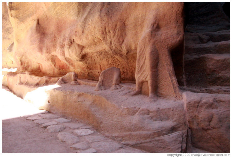 The remains of a sculpture depicting a man and a camel.