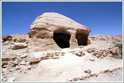 Large stone with two holes.