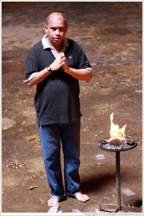 Man praying, Batu Caves.