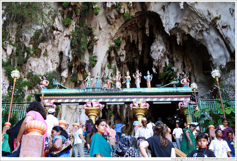 People and statues at the entrance to Batu Caves.