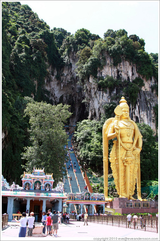 Stairway leading into Batu Caves, with Lord Murugan statue presiding.