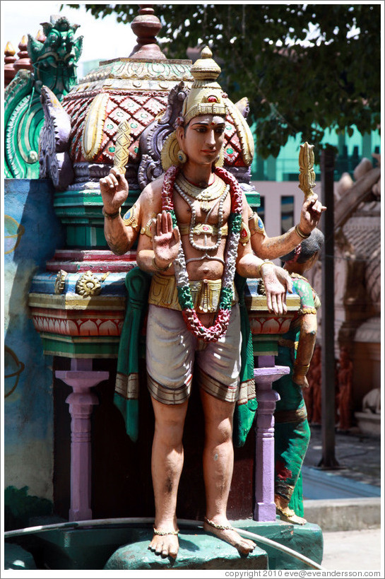 Statue over stairway to Batu Caves.