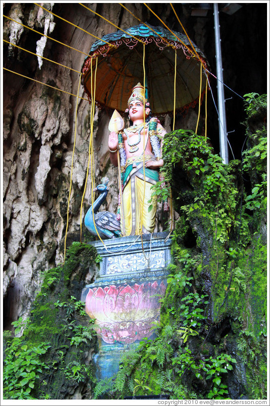 Statue of woman and peacock, Batu Caves.