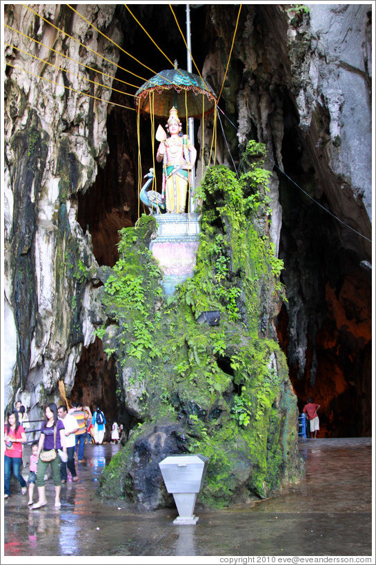 Statue of woman and peacock, Batu Caves.