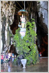 Statue of woman and peacock, Batu Caves.