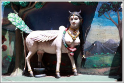 Figure, part woman and part animal, over stairway to Batu Caves.