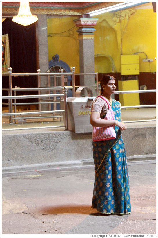 Woman in front of Main Temple, Batu Caves.