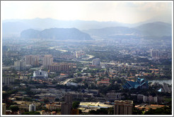 View of Kuala Lumpur from the KL Tower.  The large hill on the left in the background contains the Batu Caves.