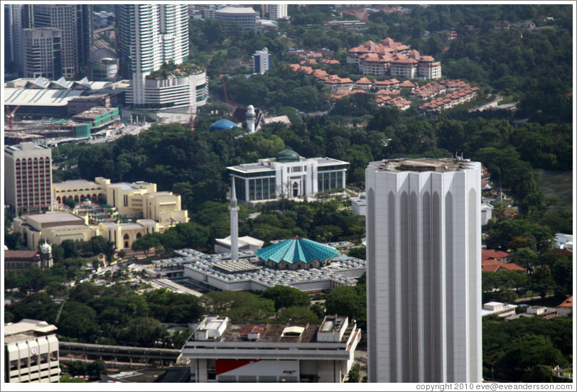 View of Kuala Lumpur from the KL Tower.  The building in the center with the aquamarine roof is the National Mosque.