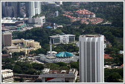 View of Kuala Lumpur from the KL Tower.  The building in the center with the aquamarine roof is the National Mosque.