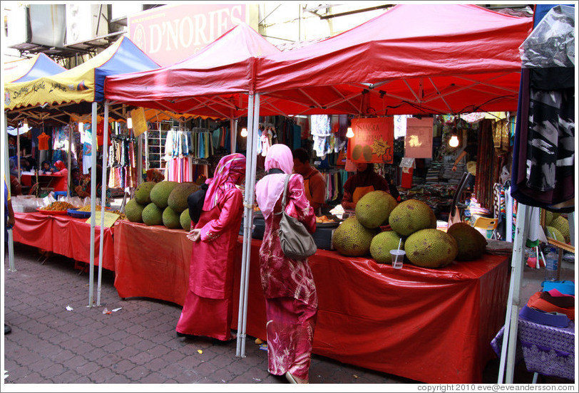 Women at a stall selling jackfruit at the market on Lorong Tuanku Abdul Rahman.