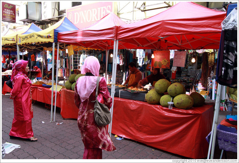 Women at a stall selling jackfruit at the market on Lorong Tuanku Abdul Rahman.