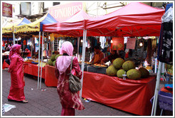 Women at a stall selling jackfruit at the market on Lorong Tuanku Abdul Rahman.