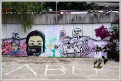 Graffiti at the bank of the Sungai Kelang depicting a veiled woman and a man selling an F-5E engine, presumably one of those from an airbase of the Royal Malaysian Air Force in Dec 2007/Jan 2008.