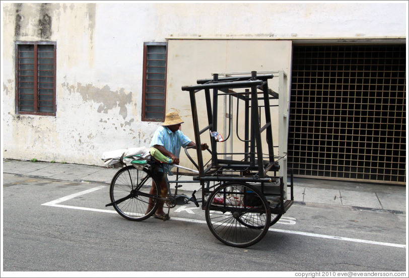 Man with a bicycle cart.