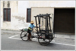 Man with a bicycle cart.