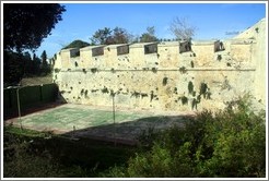 Moat around the city walls, with a tennis court in it.