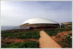 Mnajdra, a megalithic temple complex, under a high-tech protective covering.
