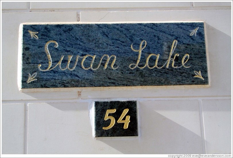 "Swan Lake" nameplate on a house.