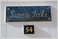 "Swan Lake" nameplate on a house.