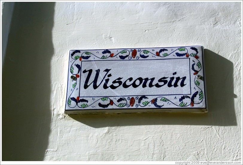 "Wisconsin" nameplate on a house.