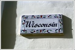 "Wisconsin" nameplate on a house.