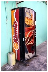 Vending machine selling Kinnie, a citrusy  Maltese soft drink.