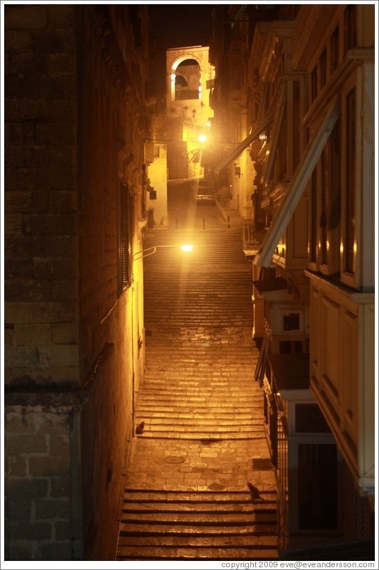 Steps on Battery Street, at night.