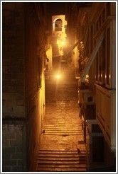 Steps on Battery Street, at night.