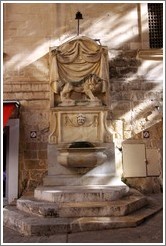 Lion fountain, exterior of St. Johns Co-Cathedral (Kon-Katidral ta' San &#288;wann).