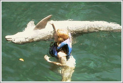 Eve swims with the dolphins.  Xcaret.