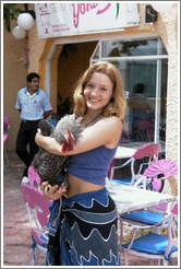 Eve holding rooster.