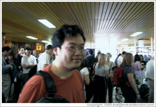 Jin waits in line at immigration in Cancun.