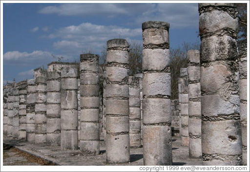 Looking down the rows of columns towards the temple of the warriors.  Chichen Itza.