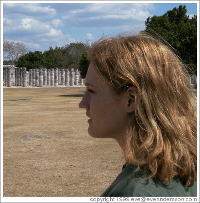 Eve stares intently at columns. Chichen Itza.