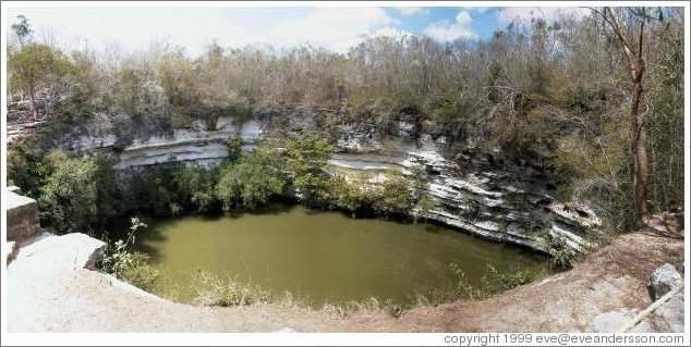 A panoramic shot of the "sacred well," or "well of the sacrifices." This is a natural well, or "cenote." Chichen Itza.