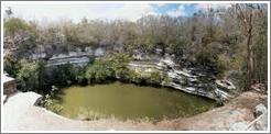 A panoramic shot of the "sacred well," or "well of the sacrifices." This is a natural well, or "cenote."   Chichen Itza.